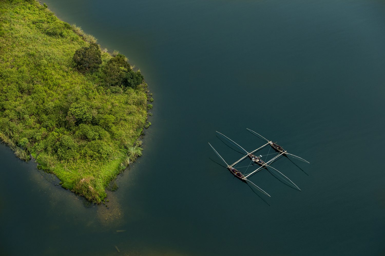 Singing fishermen rowing across Lake Kivu